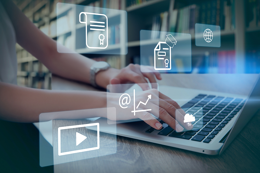 Image of Student Using Laptop In Library