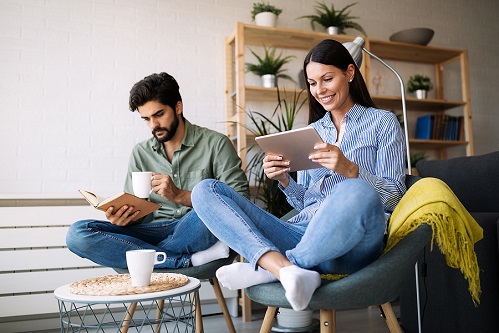 image of couple reading book and ebook